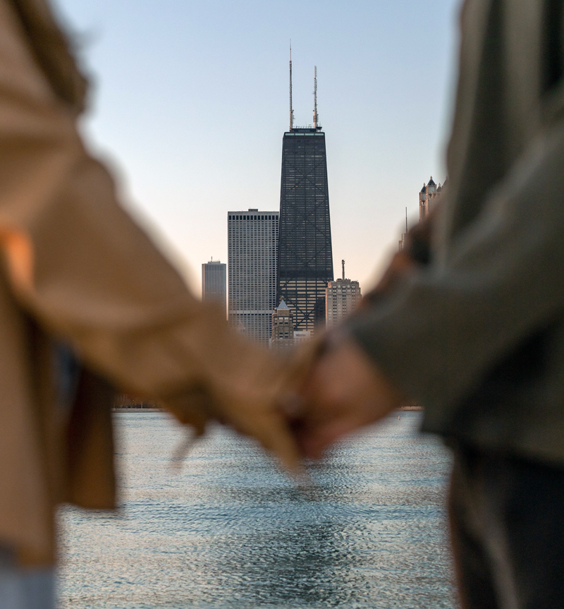 Relationship and Couples Coaching with two people holding hands with Chicago cityscape in background